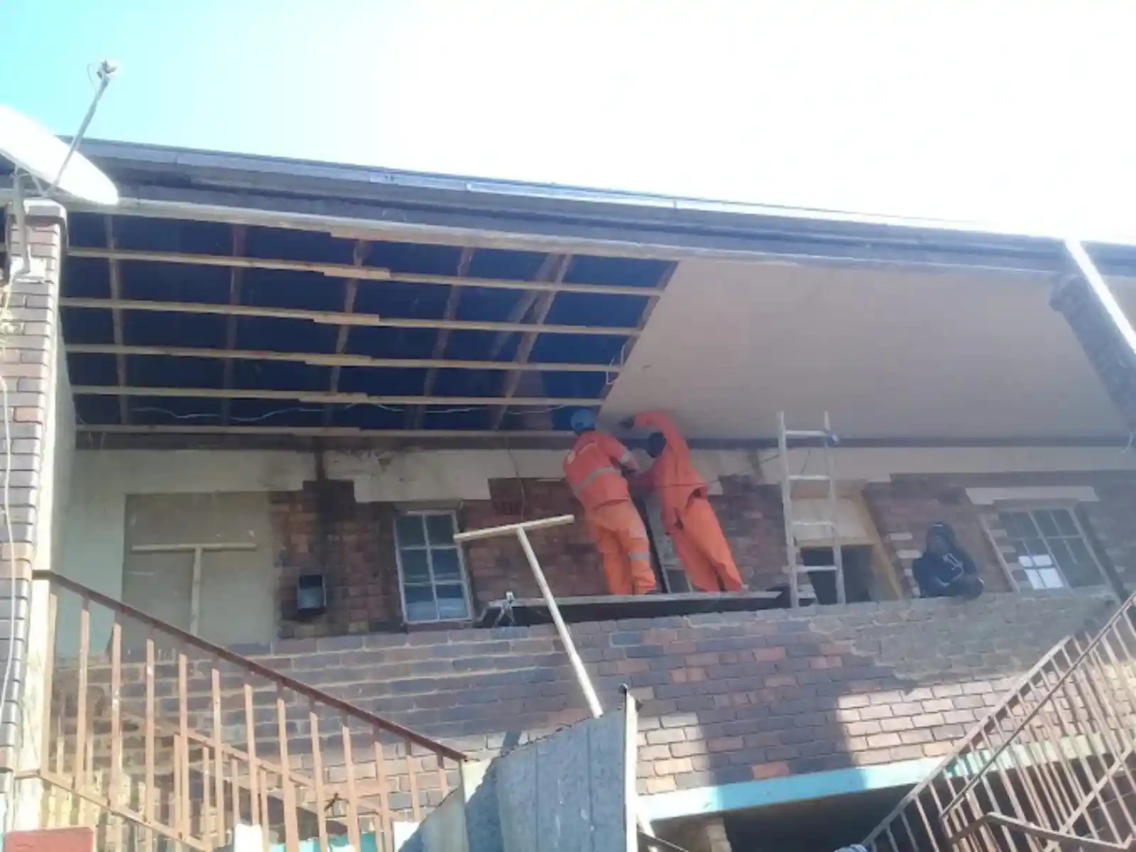 Team working on a ceiling during renovations in Cape Town